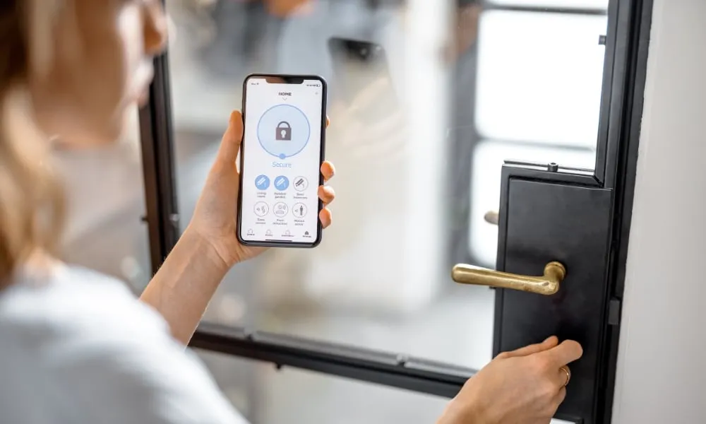 girl using her phone for smart lock while opening the door